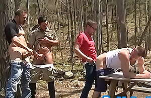Ribald gay ass screwed in open-air foursome by wood rangers